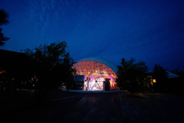 istock marquee for event in Park at night. evening light 1212905380