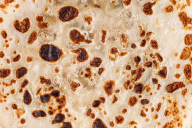 istock The texture of thin fried pancakes. Russian kitchen. Close-up. 1212905391