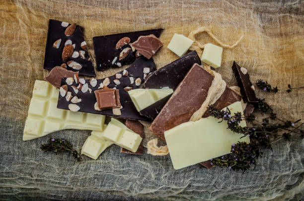 istock Black,  white, milk  chocolate pieces. Many types of chocolate 1212905476