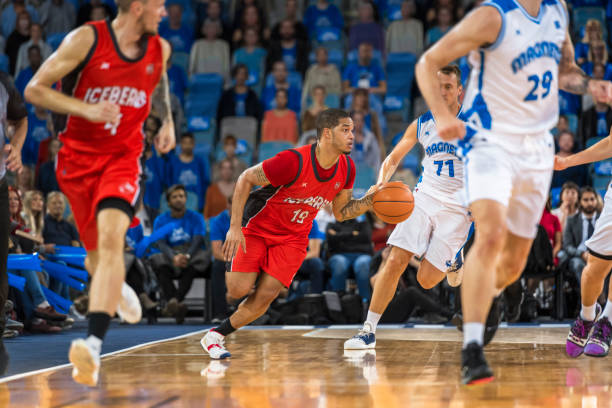 istock Basketball players chasing for ball 1212905520