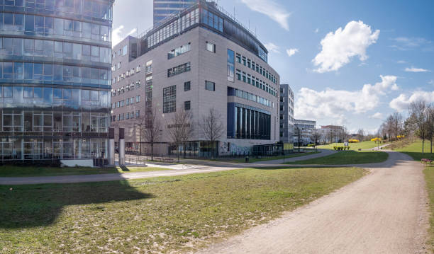 istock Modern office buildings in green public park 1212906469