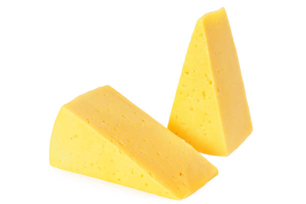 istock Cut of cheese isolated on a white background 1212906520