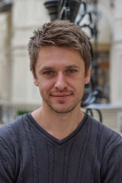 istock portrait of a young attractive blond smiling guy 1212908081