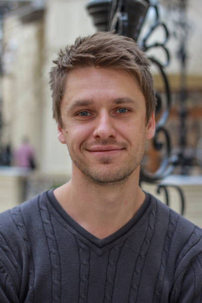 istock portrait of a young attractive blond smiling guy 1212908145
