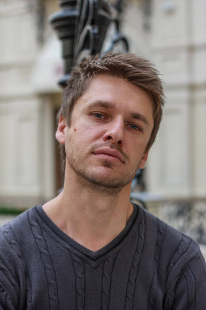 istock portrait of a young attractive blond seriously guy 1212908471