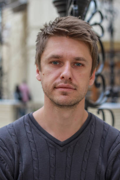 istock portrait of a young attractive blond seriously guy 1212908533
