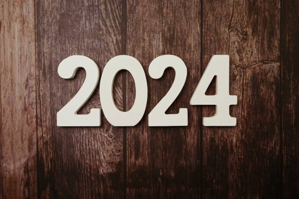 istock 2024 Happy New Year with space copy on wooden background 1212908620