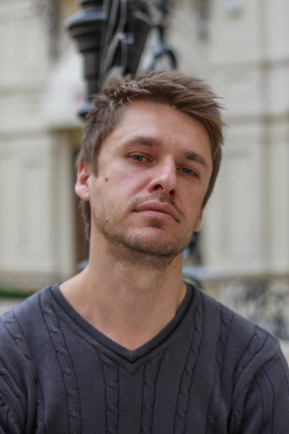 istock portrait of a young attractive blond seriously guy 1212908701