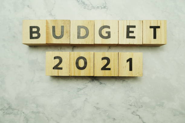 istock Budget 2021 alphabet letters on marble background 1212908881
