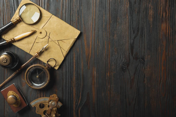 old fashioned flat lay with letters writing accessories on dark wooden background - material data sheets imagens e fotografias de stock