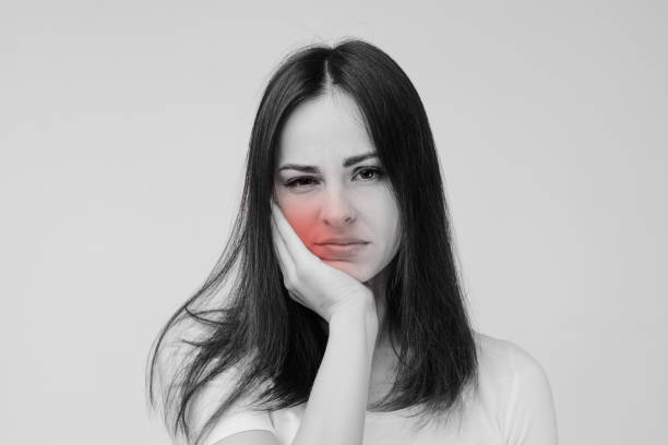 istock young sad woman suffering from tooth pain 1212911886
