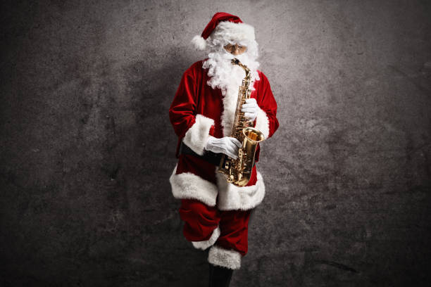 Santa Claus playing a saxophon on a rusty gray wall