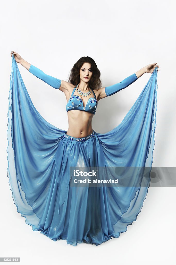 Beautiful oriental cabaret woman in blue wide dress  Drop Waist Stock Photo
