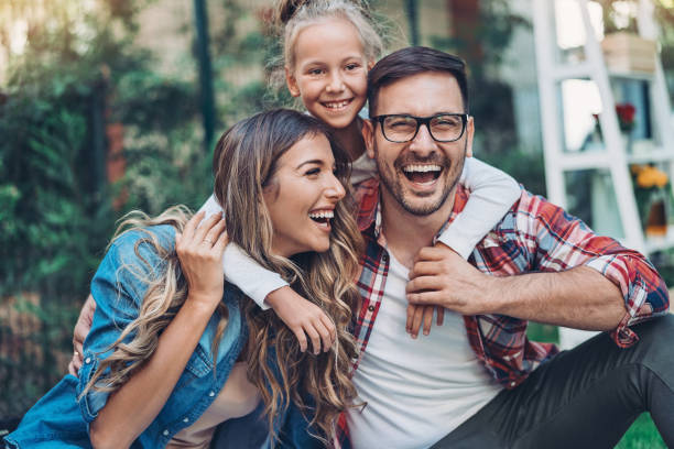 istock Happy mother, father and daughter 1212916812