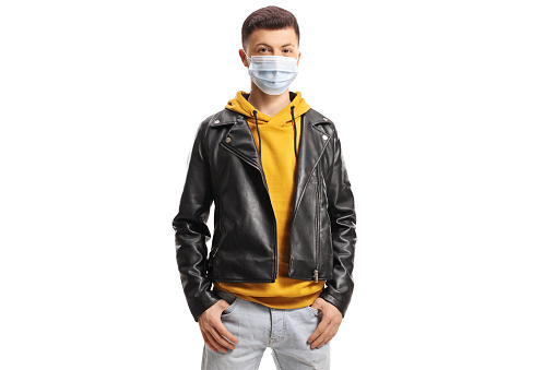 Young guy wearing a medical face mask isolated on white background