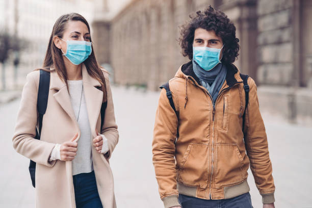istock Young couple with protective masks 1212917250