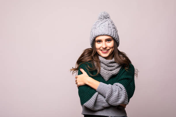 istock Young young woman with winter hat over isolated white background 1212919581