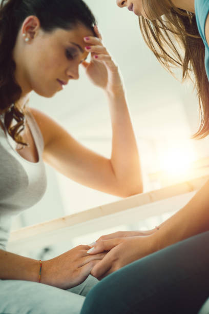istock Girl comforting her friend 1212920507