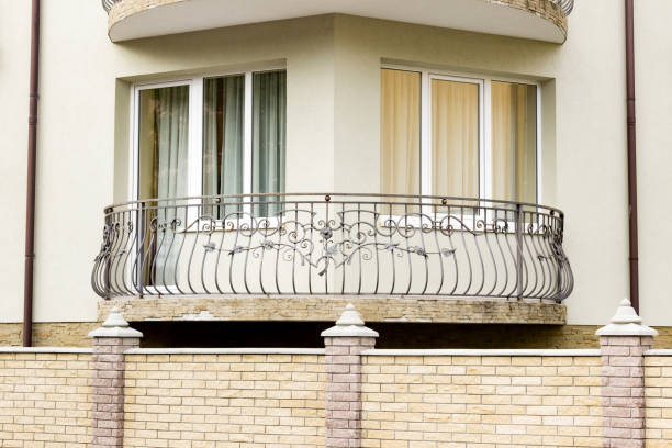 istock Beautiful small corner balcony on a modern building apartment 1212920598