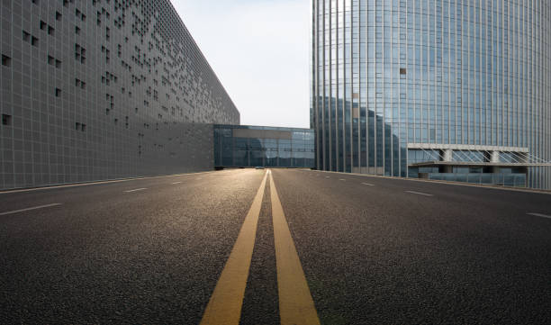 istock Divided highway passing through city buildings, blue nostalgia high contrast 1212920943