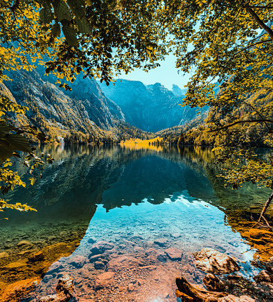 Spectacular autumn view of Oeschinensee Lake. Scene of Swiss Alps with Bluemlisalp summit on background. Location: Oeschinen valley, Canton of Bern, Switzerland, Europe