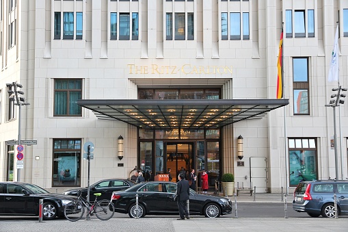 People visit Ritz-Carlton hotel in Berlin. The company has 130 luxury hotels in 30 countries.