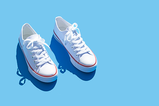 Sneakers isolated on blue background