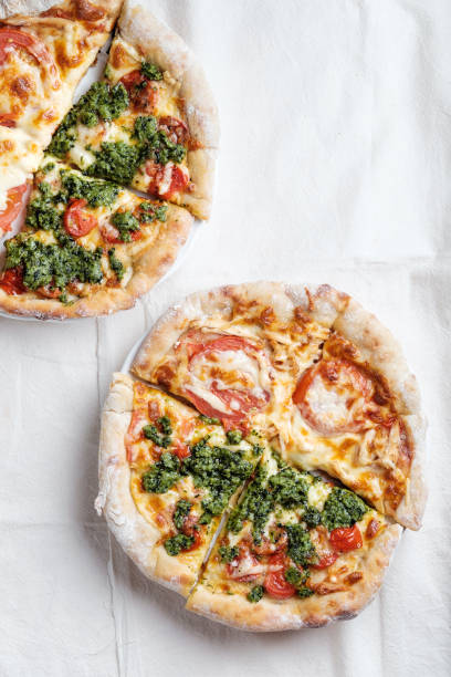 istock Pizza with tomatoes, mozzarella and pesto 1212923905