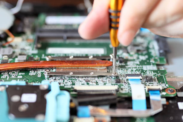istock Expert is repairing to inner of laptop with screwdriver. A laptop's central processing unit (CPU) has advanced power-saving features and produces less heat than one intended purely for desktop use. 1212924076