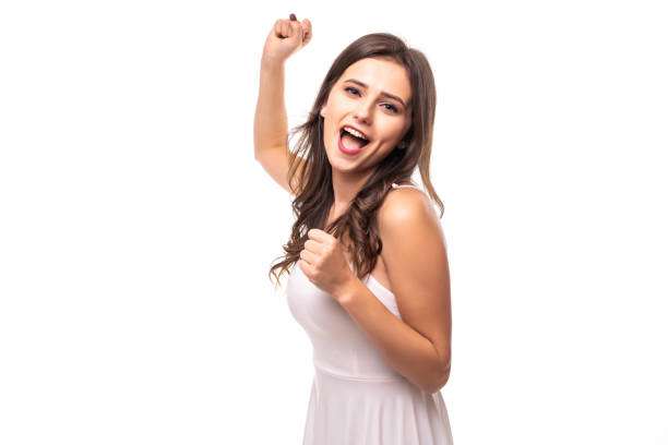 istock Happy woman celebrating win isolated on white background 1212924232