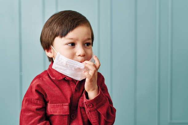 istock 2-3 years old cute child wearing surgical mask. 1212925522