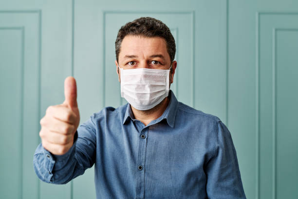 30-39 years old man wearing surgical mask.