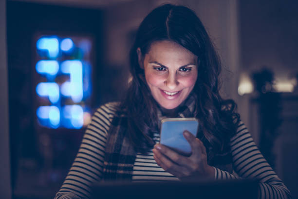 istock Woman using mobile phone in the restaurant 1212927273