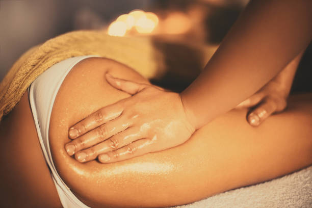 Anti cellulite massage. Unrecognizable woman having a anti cellulite massage at beauty spa. immersed in their work stock pictures, royalty-free photos & images
