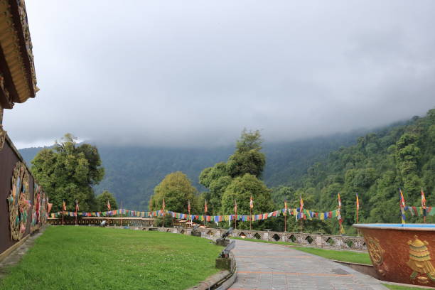 istock Mountain landscape with cloudy sky and green forest in Sikkim, India 1212928729