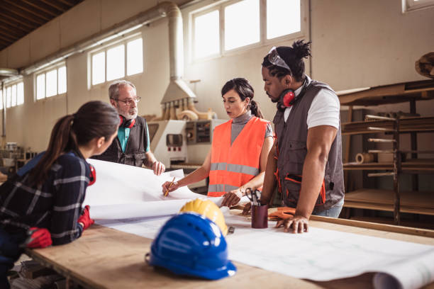 istock Female engineer directing her colleagues 1212929913