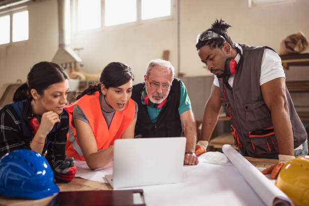 istock Female engineer directing her colleagues 1212929925
