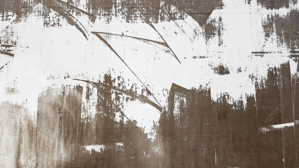 istock Weathered and aged concrete wall with paint, mostly peeled from black and white with vignetting. Shades of gray and white. Great modern, textured background. Abstract old background 1212931380