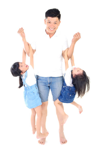 Being with family is bliss. Parents with daughters playing in nature.