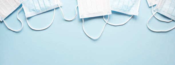 istock Banner for the site with medical masks on a light blue background. 1212932160