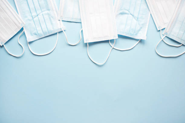 istock Medical masks on a light blue background. 1212932384