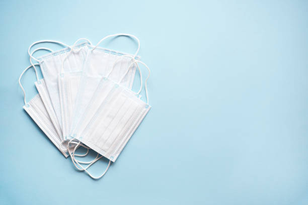 istock Medical masks on a light blue background. 1212933108