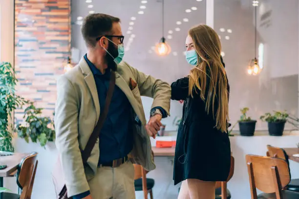 Photo of Business people greeting during COVID-19 pandemic