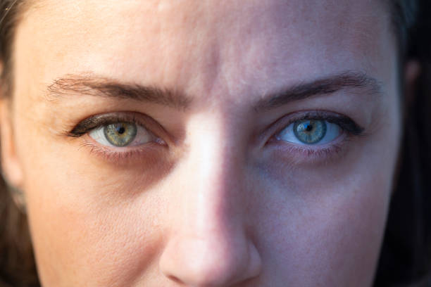 istock Cold and hot light woman eyes, face 1212935694