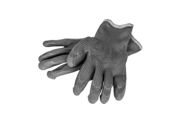 istock a pair protective gloves for gardening, construction and repair work isolated on a white background, black and white photo 1212936424