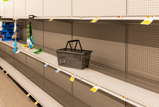 Empty shelves at a grocery store stock photo
