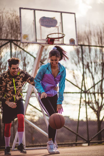 istock Young couple playing basketball. 1212939197