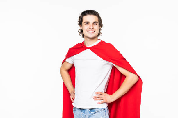istock Handsome man in red superhero cape over white background 1212939662