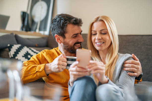 istock Young couple relaxing at home 1212940298