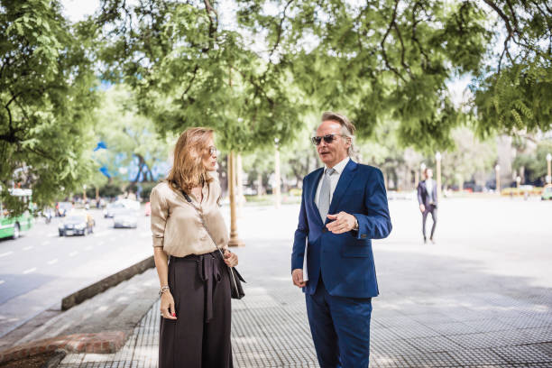 istock CEO and his secretary walking to the office 1212940725